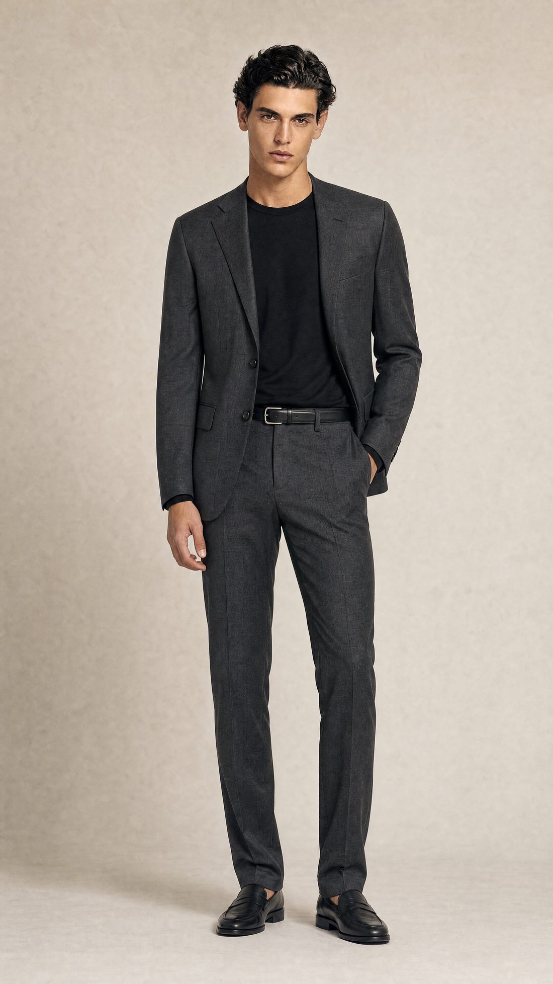 A made-to-measure charcoal suit in Biella wool, cut by hand at the Linea di Biella atelier