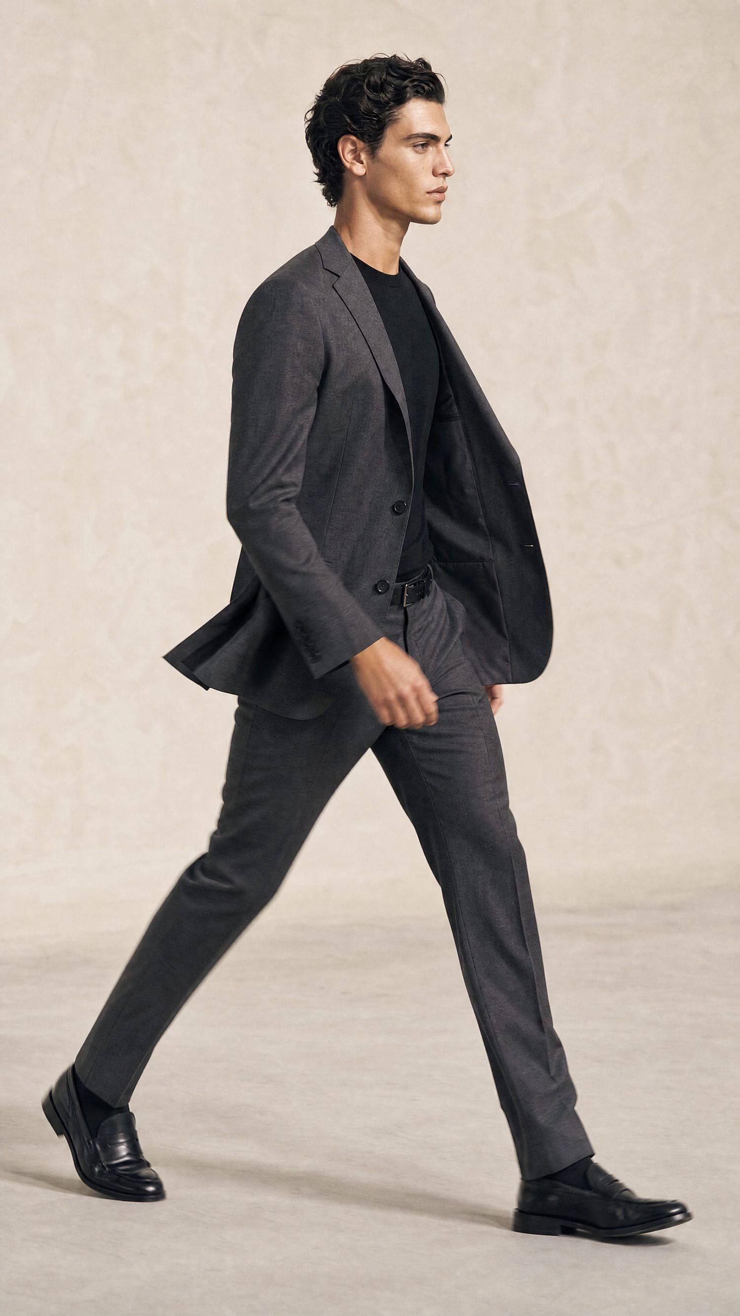 A model walking in a hand-finished Biella-wool suit, Linea di Biella